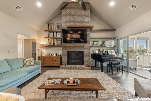 18576 N Jamestown Ave, Skiatook, OK 74070 - living room with a fireplace, visible vents, wood finished floors, and high vaulted ceiling