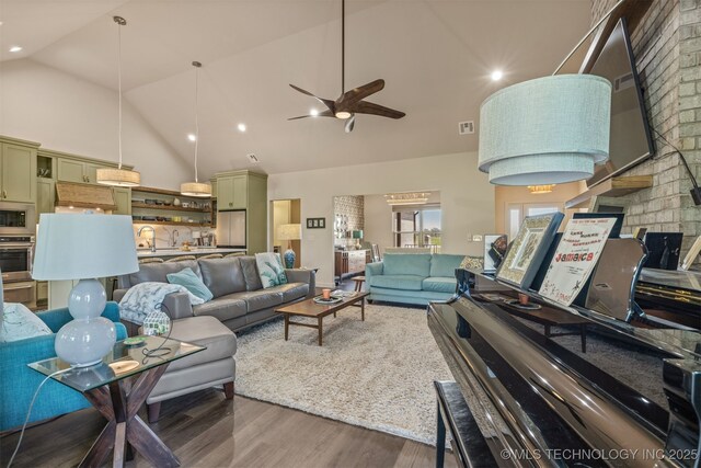 18576 N Jamestown Ave, Skiatook, OK 74070 - living area with recessed lighting, ceiling fan, visible vents, high vaulted ceiling, and wood finished floors