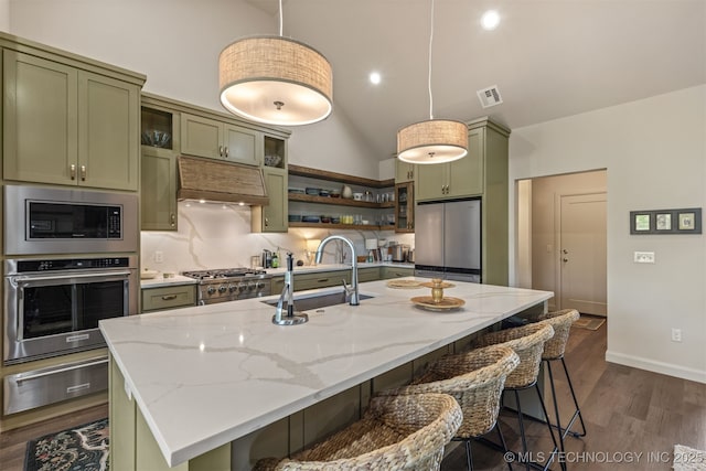 18576 N Jamestown Ave, Skiatook, OK 74070 - kitchen featuring green cabinets, visible vents, a sink, a warming drawer, and appliances with stainless steel finishes
