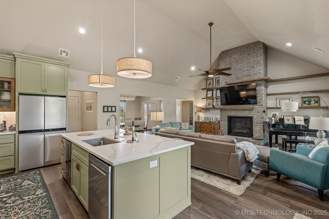 18576 N Jamestown Ave, Skiatook, OK 74070 - kitchen featuring high vaulted ceiling, a sink, green cabinetry, ceiling fan, and appliances with stainless steel finishes
