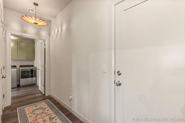 18576 N Jamestown Ave, Skiatook, OK 74070 - hall with washing machine and clothes dryer, baseboards, dark wood-style floors, and visible vents