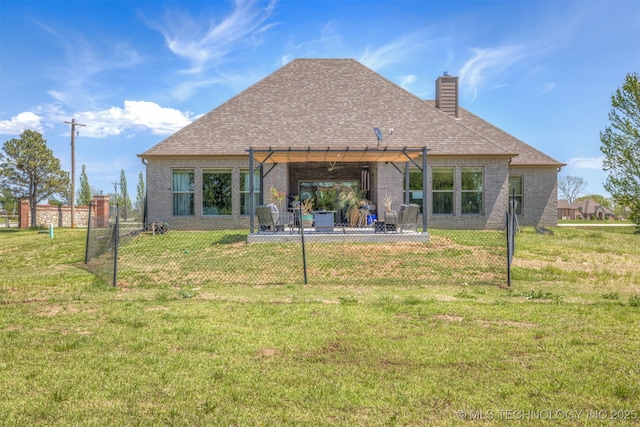 18576 N Jamestown Ave, Skiatook, OK 74070 - back of house with a lawn, a pergola, brick siding, and fence