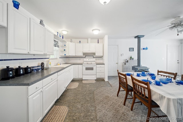 857 Bayshore Dr, Sand Springs, OK 74063 - kitchen with white appliances, a wood stove, a ceiling fan, white cabinetry, and open shelves