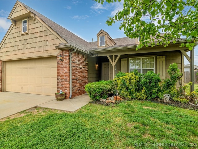 view of front facade featuring a front yard, brick siding, roof with shingles, concrete driveway, and an attached garage