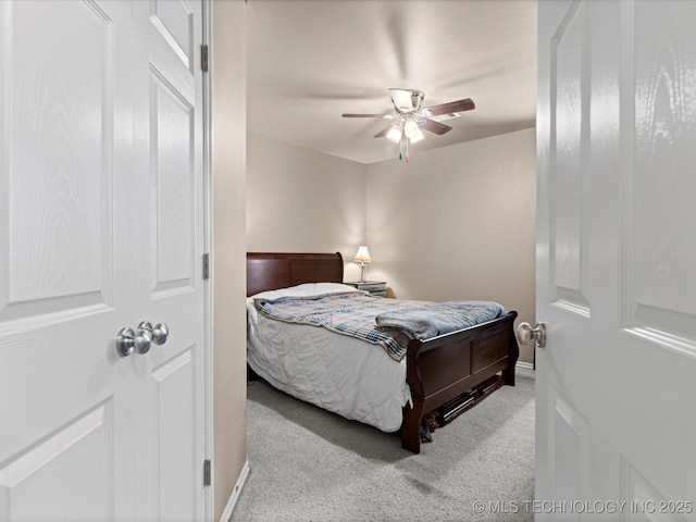 carpeted bedroom featuring ceiling fan and baseboards