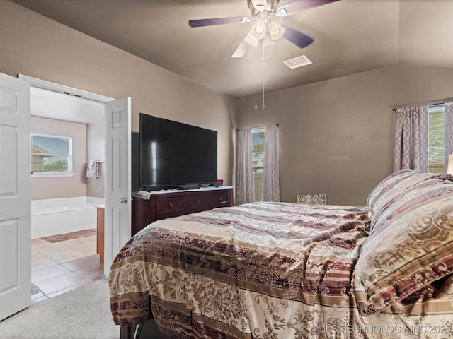 bedroom featuring lofted ceiling, visible vents, multiple windows, and light colored carpet
