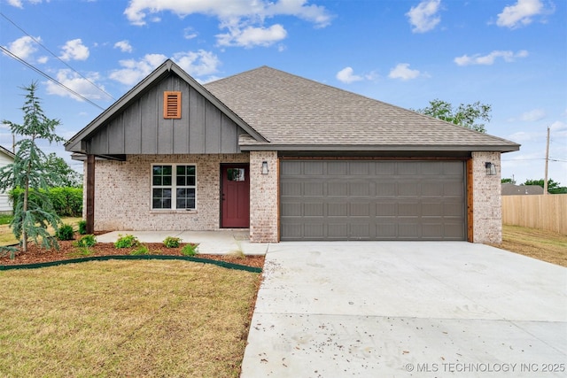 919 E 11th St, Claremore, OK 74017 - view of front of house featuring board and batten siding, concrete driveway, an attached garage, and brick siding
