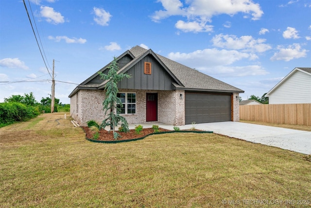 919 E 11th St, Claremore, OK 74017 - view of front facade featuring driveway, board and batten siding, a garage, brick siding, and a shingled roof