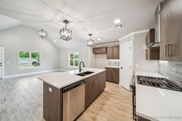 919 E 11th St, Claremore, OK 74017 - kitchen with appliances with stainless steel finishes, a sink, recessed lighting, light countertops, and decorative backsplash