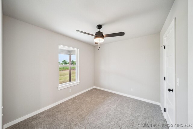 919 E 11th St, Claremore, OK 74017 - carpeted spare room with baseboards and a ceiling fan