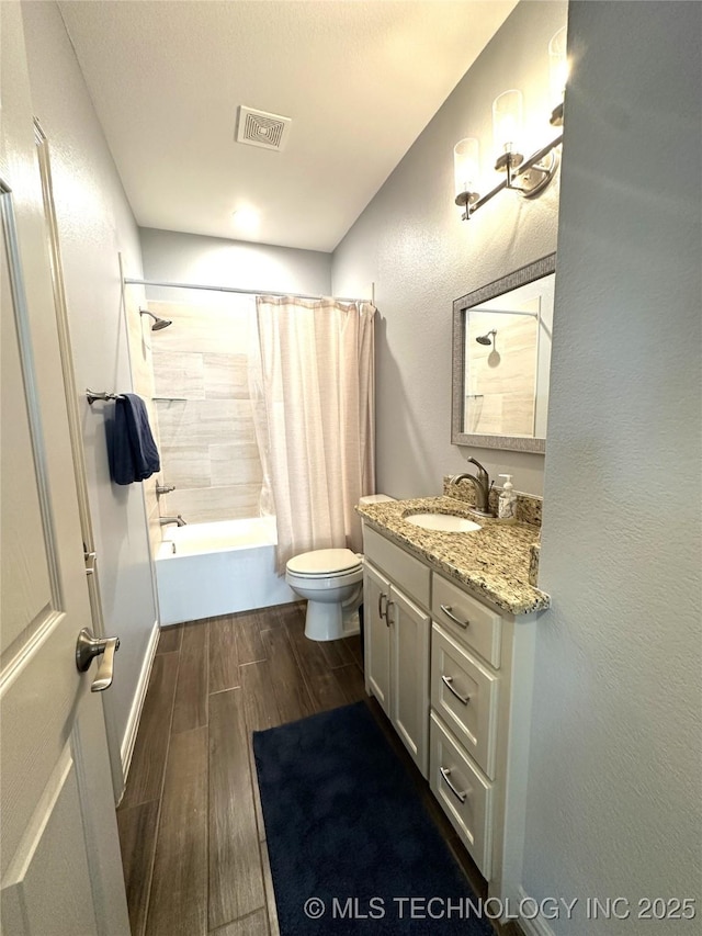 full bath with toilet, visible vents, wood finished floors, shower / bathtub combination with curtain, and vanity