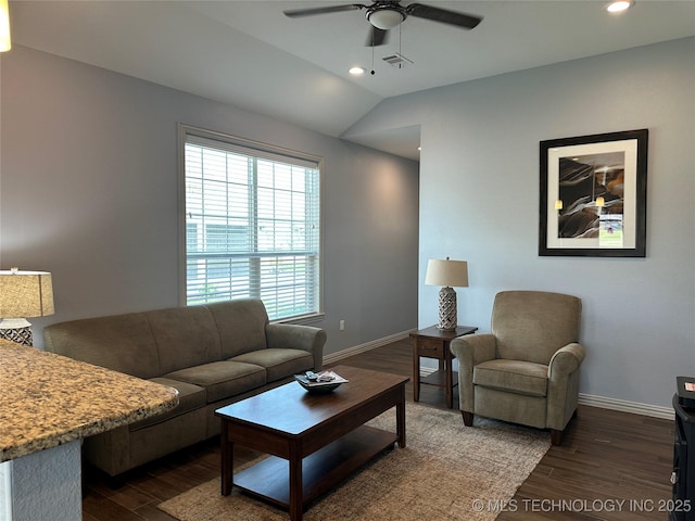 living room featuring baseboards, a ceiling fan, visible vents, and dark wood-type flooring