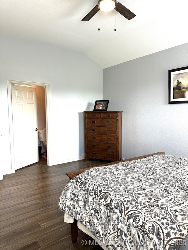 bedroom with dark wood-type flooring, vaulted ceiling, baseboards, and ceiling fan