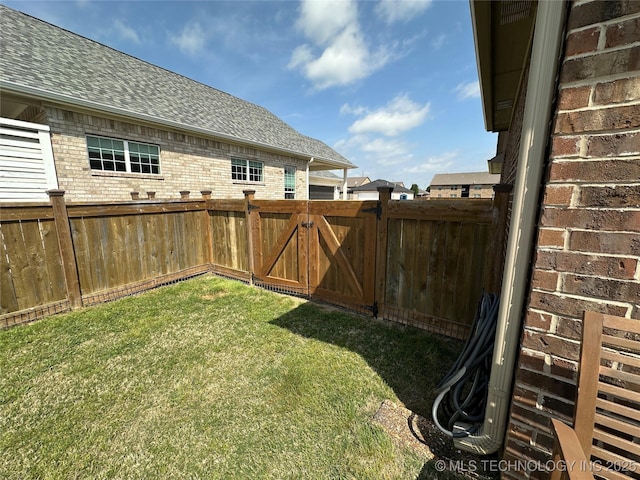 view of yard featuring a fenced backyard