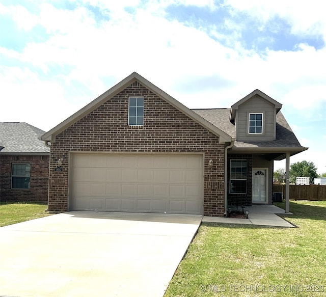 view of front of house featuring an attached garage, brick siding, a front yard, and concrete driveway