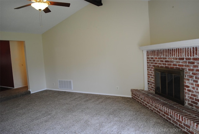 unfurnished living room with ceiling fan, carpet floors, vaulted ceiling with beams, and visible vents