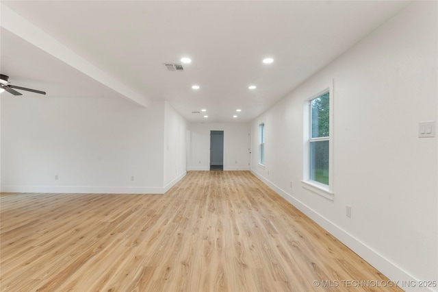 unfurnished living room featuring a ceiling fan, recessed lighting, baseboards, light wood finished floors, and visible vents