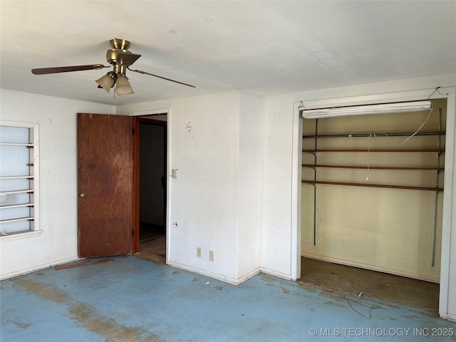 unfurnished bedroom with ceiling fan and concrete floors