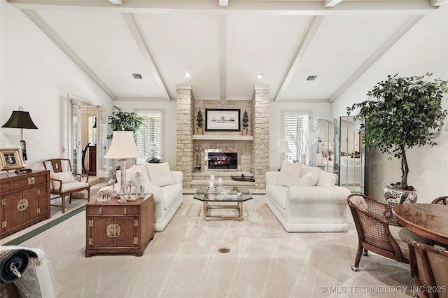 749 Brookhollow Ln, Bartlesville, OK 74006 - living area with a stone fireplace, a healthy amount of sunlight, and visible vents