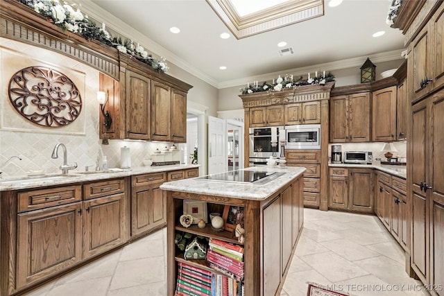 749 Brookhollow Ln, Bartlesville, OK 74006 - kitchen featuring visible vents, a skylight, decorative backsplash, open shelves, and appliances with stainless steel finishes