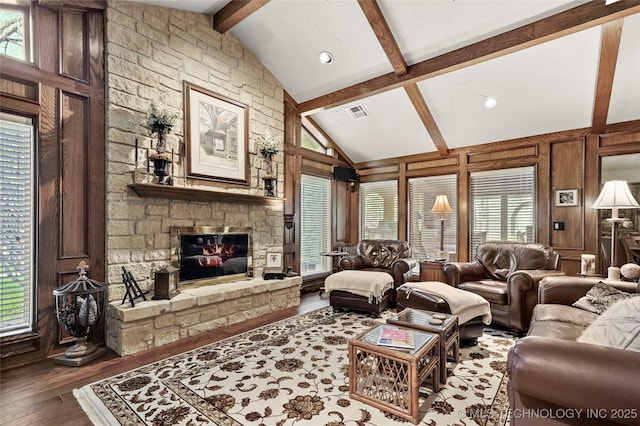 749 Brookhollow Ln, Bartlesville, OK 74006 - living room featuring vaulted ceiling with beams, visible vents, recessed lighting, wood finished floors, and a fireplace