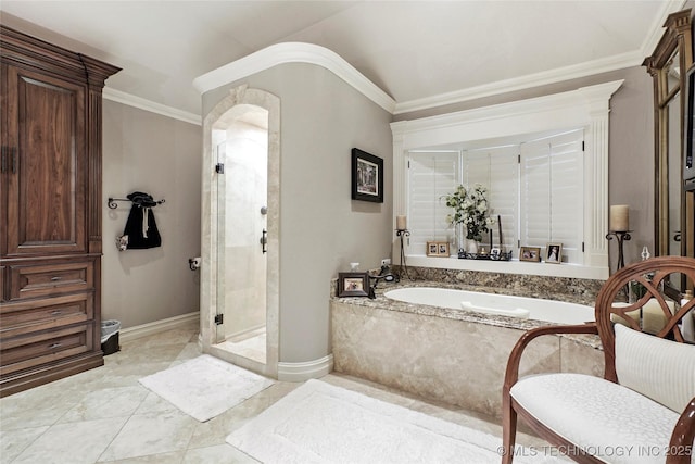 749 Brookhollow Ln, Bartlesville, OK 74006 - bathroom with baseboards, a bath, crown molding, and a stall shower