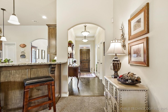 929 S 71st St, Broken Arrow, OK 74014 - entryway featuring arched walkways, crown molding, recessed lighting, baseboards, and dark wood-style flooring