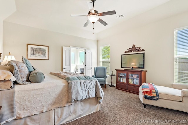 929 S 71st St, Broken Arrow, OK 74014 - bedroom featuring carpet flooring, ensuite bath, and a ceiling fan