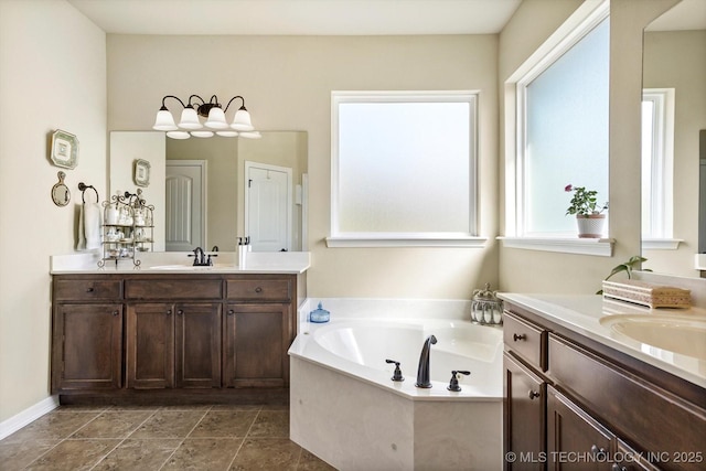 929 S 71st St, Broken Arrow, OK 74014 - bathroom featuring two vanities and a bath