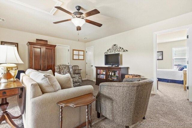 929 S 71st St, Broken Arrow, OK 74014 - carpeted living room featuring a ceiling fan and baseboards