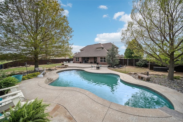 view of swimming pool featuring a fenced backyard, a fenced in pool, and a patio