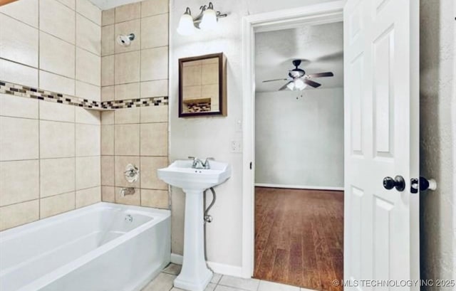 full bath featuring baseboards, a ceiling fan, tile patterned flooring, and bathtub / shower combination