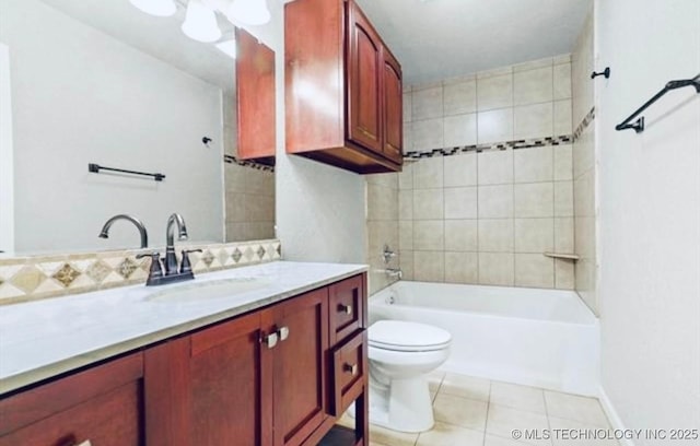 full bathroom featuring tasteful backsplash, toilet, tile patterned flooring, vanity, and tub / shower combination