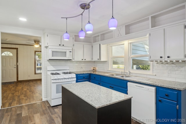 kitchen featuring decorative backsplash, a sink, blue cabinets, and white appliances