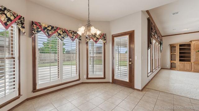 unfurnished dining area featuring a chandelier, visible vents, baseboards, and light tile patterned floors