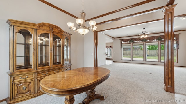 dining room featuring ceiling fan with notable chandelier, ornamental molding, and light colored carpet