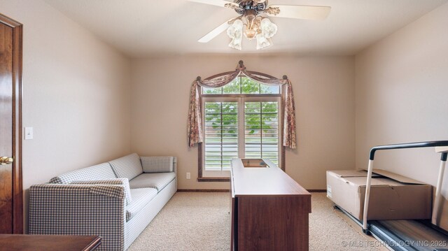 office with light carpet, a ceiling fan, and baseboards