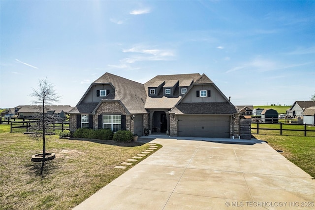 view of front of property featuring concrete driveway, a front yard, and fence