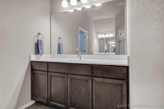 bathroom featuring vanity and baseboards