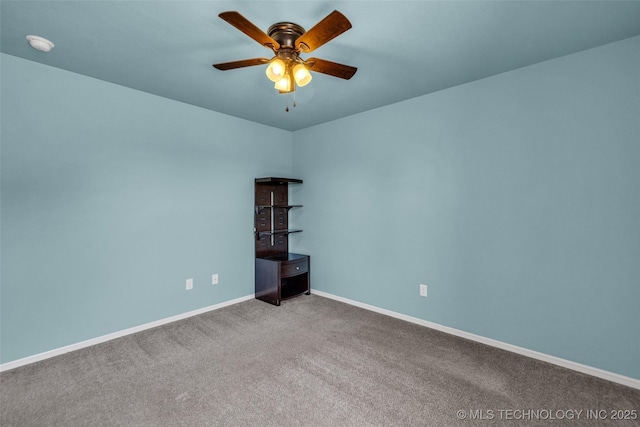 unfurnished room with carpet flooring, a ceiling fan, and baseboards