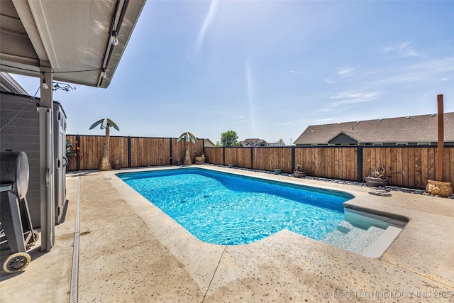 view of swimming pool featuring a fenced backyard, a patio, and a fenced in pool
