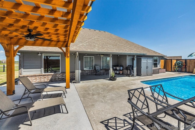 view of pool featuring a fenced in pool, a patio, fence, and a ceiling fan