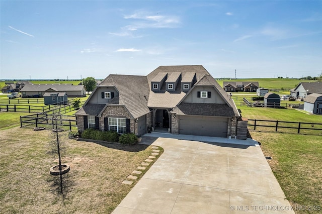 view of front of property featuring a residential view, driveway, a front lawn, and fence