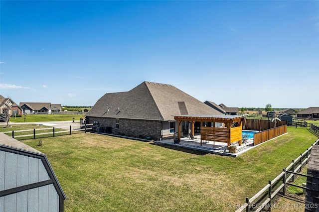 view of home's exterior featuring a lawn, a patio, a fenced backyard, and roof with shingles