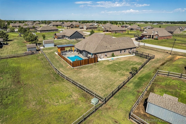 birds eye view of property with a residential view