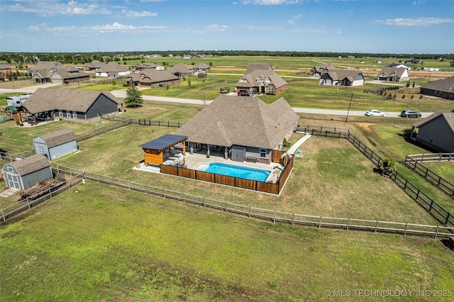 aerial view featuring a residential view and a rural view