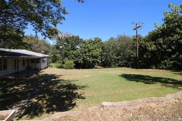 988 Wilson St, Durant, OK 74701 - view of yard featuring a patio area