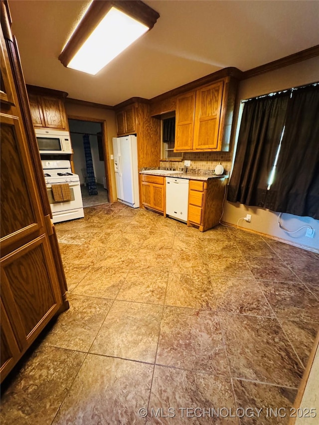 503 NW 2nd St, Checotah, OK 74426 - kitchen featuring a sink, decorative backsplash, white appliances, brown cabinets, and light countertops