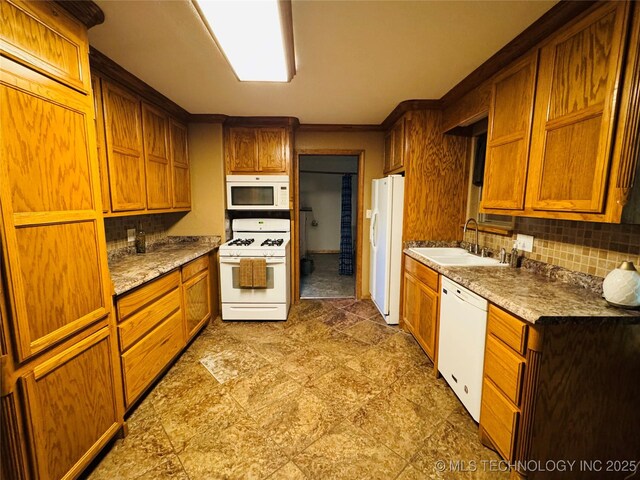 503 NW 2nd St, Checotah, OK 74426 - kitchen with brown cabinets, ornamental molding, a sink, white appliances, and decorative backsplash
