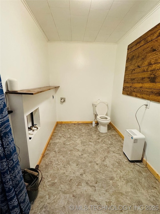 503 NW 2nd St, Checotah, OK 74426 - washroom with baseboards, ornamental molding, hookup for a washing machine, and laundry area